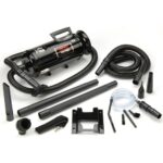 A black vacuum is shown with its accessories.