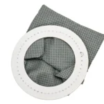 A white circular frame and a black and white cloth.
